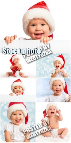     / Kid in Santa hats - stock photos